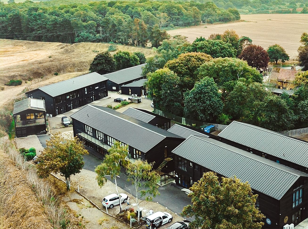 Aerial view of the converted barns and Suffolk countryside at Brightwell Barns business park